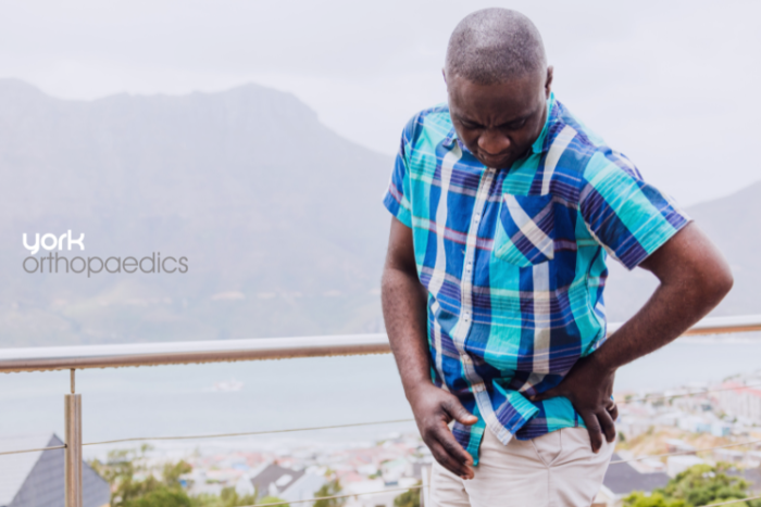 Arthritis Early Signs Diagnosis Treatment Older man holding hip in pain