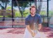 Healthy, fit tennis player smiling on court