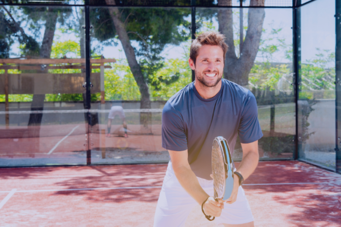 Preventing Summer Sporting Injuries Healthy, fit tennis player smiling on court