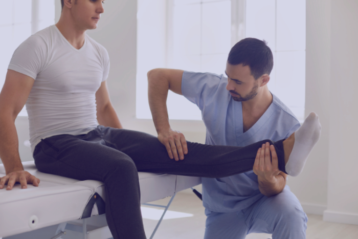Prehabilitation and Rehabilitation Why Important Man with physiotherapist holding knee
